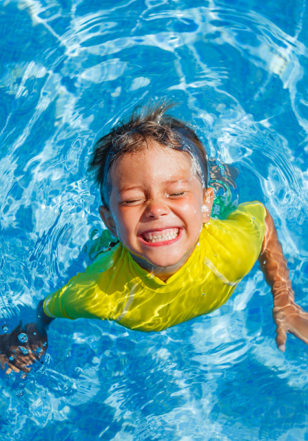 Child in fibreglass swimming pool