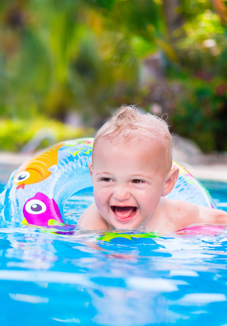 Baby in fibreglass swimming pool